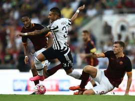 Pereyra is challenged by Roma's Edin Dzeko. AFP