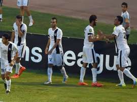 Tunisias CS Sfaxien players celebrate after scoring a goal during a CAF Champions League match in Tunis