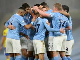 Manchester City celebrate Phil Fodens goal against Brighton. AFP