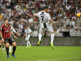 Cristiano Ronaldo rises to head home his 16th goal of the season. AFP