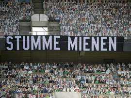 Gladbach's cardboard fans saw their side lose against Leverkusen. AFP
