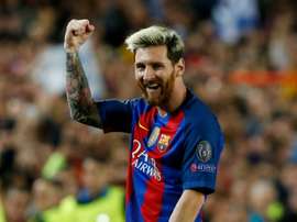 Messi celebrating a goal for Barca. AFP
