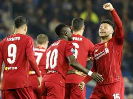 Liverpool, Chelsea win on road as Messi, Mertens and Haaland set goals records. AFP
