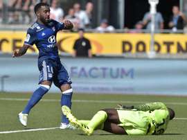 Alexandre Lacazette (L) scores for Lyon. AFP