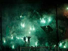 Panathinaikos were fined 190,000 euros and instructed to play four home matches behind closed doors, while the league handed Olympiakos a 3-0 victory for the disrupted match