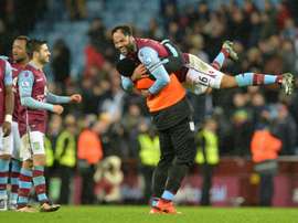 Aston Villas defender Joleon Lescott (top) celebrates after winning the match between Aston Villa and Crystal Palace at Villa Park in Birmingham, on January 12, 2016