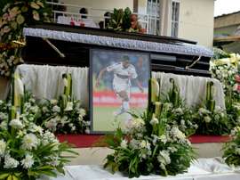 The casket and portrait of international soccer star Patrick Ekeng, who died after collapsing during a match in Romania, during his funeral in Yaounde on May 15, 2016