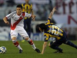 Argentinas Matias Kranevitter (L), pictured here playing for River Plate in 2014, will join Atletico Madrid in December