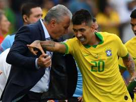 Tite et Firmino. AFP