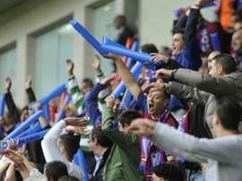 Eibar fans celebrate during a match at the Ipurua stadium in Eibar on May 31, 2014