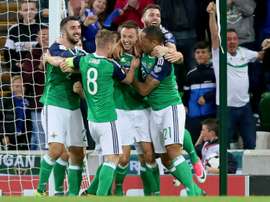 Northern Ireland's defender Jonny Evans (C) celebrates scoring during a World Cup qualifier. AFP
