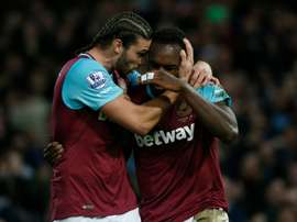 West Ham Uniteds midfielder Michail Antonio celebrates with striker Andy Carroll (L) after scoring their first goal during the English Premier League football match against Southampton in Upton Park, in east London on December 28, 2015