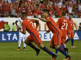 Chiles Alexis Sanchez (L) celebrates with teammate Eduardo Vargas after scoring against Panama during their Copa America Centenario match, in Philadelphia, Pennsylvania, on June 14, 2016