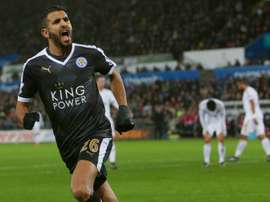 Leicester Citys Algerian midfielder Riyad Mahrez celebrates after scoring his third goal during a match against Swansea City Stadium in Swansea, south Wales on December 5, 2015