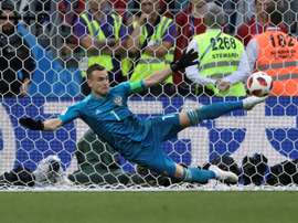 Akinfeev is gaining cult status. AFP