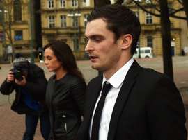 Former Sunderland footballer Adam Johnson (R) and his former girlfriend Stacey Flounders (L) leave Bradford Crown Court in Bradford, England, on February 29, 2016