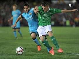 Barcelonas Brazilian defender Douglas (L) vies with Villanovenses defender Tapia during the Spanish Copa del Rey Round of 32 first leg football match at the Romero Cuerda stadium in Villanueva de la Serena on October 28, 2015