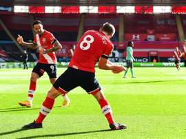 Southampton goal-scorer James Ward-Prowse (C) celebrates with Danny Ings (L). AFP