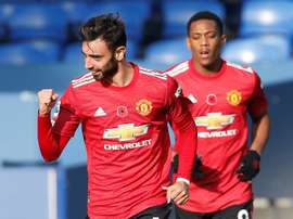 Manchester United midfielder Bruno Fernandes celebrates his equaliser against Everton. AFP