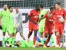Willi Orban (R) celebrates scoring RB Leipzigs equaliser at Wolfsburg.AFP