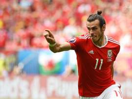 Wales forward Gareth Bale celebrates after scoring the first goal during the Euro 2016 group B football match between Wales and Slovakia at the Stade de Bordeaux in Bordeaux on June 11, 2016
