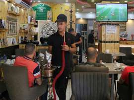 Iraqis buy into World Cup fever, without breaking the bank. AFP