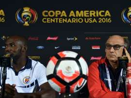 Patrice Neveu (R), coach of the Haitis mens team, with football player Jean Marc Alexandre during a press conference in Orlando, Florida on June 7, 2016
