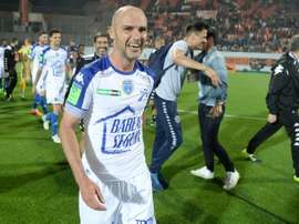 Troyes midfielder Benjamin Nivet celebrates at the end of the play-off match against Lorient