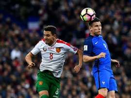 Frances forward Kevin Gameiro (R) and Bulgarias forward Dimitar Rangelov head the ball during the FIFA World Cup 2018 qualifying football match France vs Bulgaria on October 7, 2016