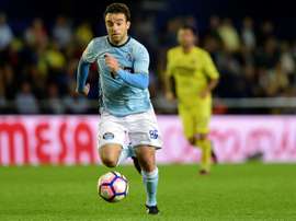 Rossi has not played since the charge was brought. AFP