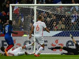 Frances midfielder NGolo Kante (2nd L) scores the opening goal during the international friendly football match against Russia at the Stade de France in Saint-Denis, north of Paris, on March 29, 2016