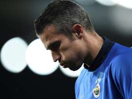 Van Persie heading home. AFP