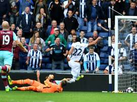 West Bromwich Albions midfielder Nacer Chadli (R) scores their fourth goal during the English Premier League football match between West Bromwich Albion and West Ham United at The Hawthorns stadium on September 17, 2016