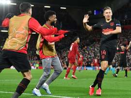 Llorente double stuns Liverpool to take Atletico into quarter-finals. AFP