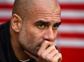 Guardiola says he is enjoying the challenge of battling for silverware. AFP