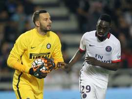 Inter Milans Slovenian goalkeeper Samir Handanovic (L) prepares to kick the ball past Paris Saint-Germain (PSG)s French forward Jean-Kevin Augustin at Jassim Bin Hamad Stadium in the Qatari capital Doha, on December 30, 2015