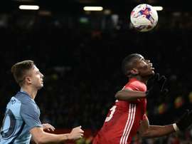 Maffeo keeps a close eye on Paul Pogba in the EFL Cup clash between Man City and Man Utd. AFP