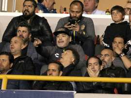 Maradona sits out a suspension in the stands. AFP