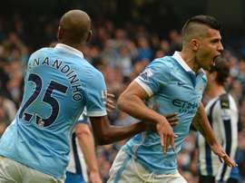 Manchester Citys Sergio Aguero (R) celebrates after scoring his first goal against Newcastle on October 3, 2015