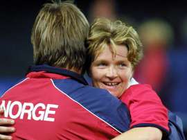 Hege Riise (right) is to lead a training camp for England Women. AFP