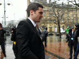 Former Sunderland footballer Adam Johnson (C) arrives at Bradford Crown Court in Bradford, northern England, on March 2, 2016