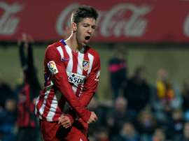 Atletico Madrids forward Luciano Vietto celebrates after scoring a goal during a Spanish Copa del Rey football match against Reus at the Estadi Municipal de Reus on December 1, 2015