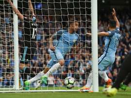 Manchester Citys striker Gabriel Jesus (C) turns to celebrate after scoring the opening goal. AFP