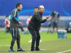 Benitez, van Bronckhorst plunged into China basement scrap. AFP
