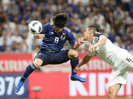 Japan's midfielder Takumi Minamino pictured scoring for Japan. AFP