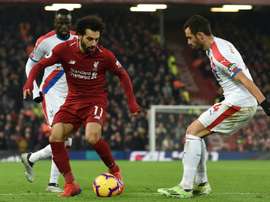 Salah brilhou e Firmino fez história. AFP