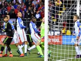 United States goalkeeper Brad Guzan (2R) watches helpless as a header from Rafael Marquez of Mexico (not pictured) gives them the winning goal in their World Cup qualifier