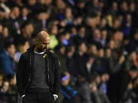 Pep Guardiola's side crashed out in a shock victory for Wigan Athletic. AFP
