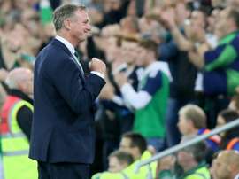Michael O'Neill has joined Stoke, but will remain NI manager for another few months as well. AFP