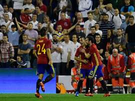 Spains midfielder Santi Cazorla (C) celebrates with Spains forward Juan Mata after scoring during the friendly football match Spain vs England at the Jose Rico Perez stadium in Alicante on November 13, 2015